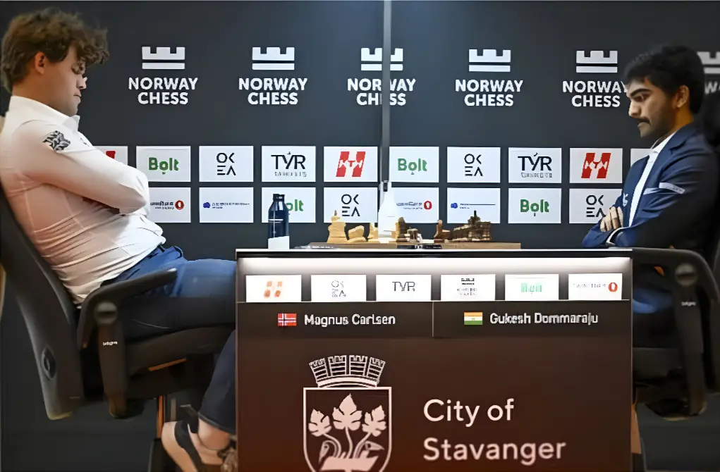 D Gukesh shaking hands with Magnus Carlsen after their match at Norway Chess 2025, following his historic win.